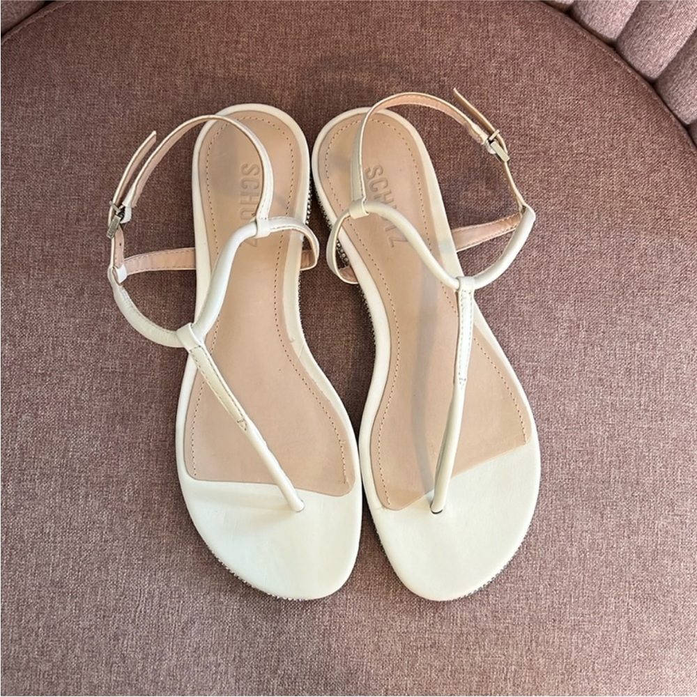 White t-strap Schutz sandals with rhinestone details. Never worn. Size 38/7